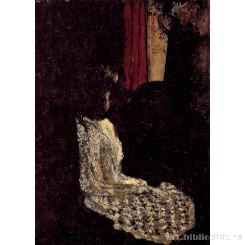 Женщина, сидящая в темной комнате