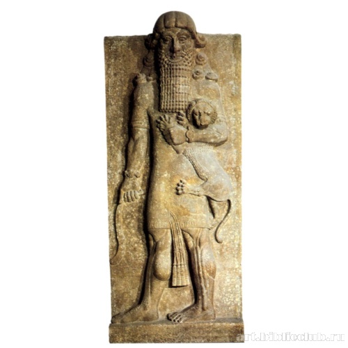 Барельеф с изображеним мужчины (Гильгамеша), держащего в руках львенка и нож