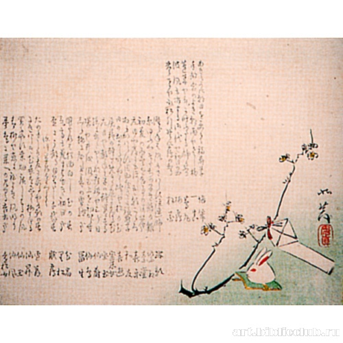 Ветка цветущей сливы и статуэтка кролика